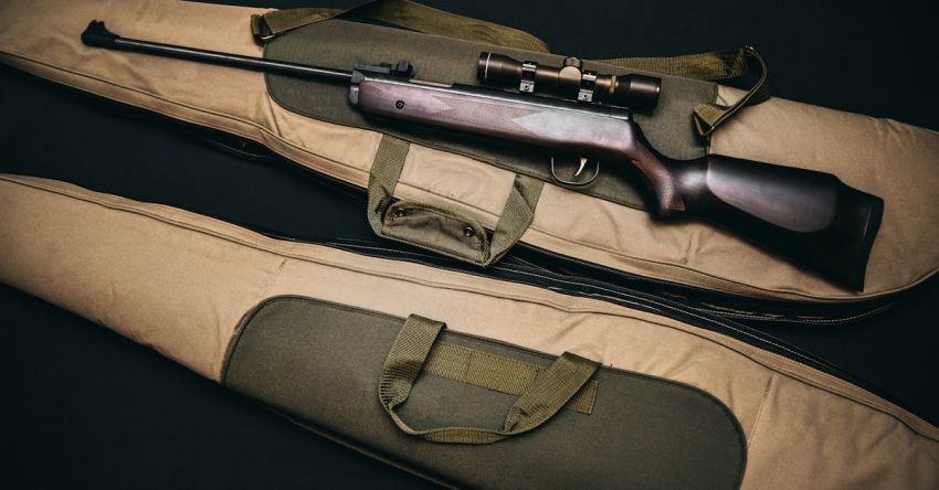 Hunting - Black Rifle With Scope and Brown Gig Bag